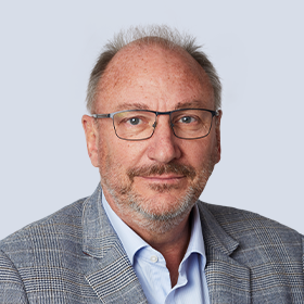 A portrait photograph of Brambles' Non-Executive Chair, John Mullen